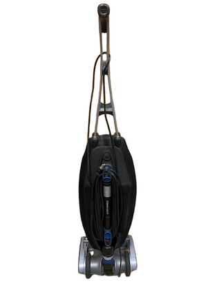 Refurbished Oreck Magnesium vacuum cleaner by Imagine Sewing & Vacuum features a black body, handle, attached power cord, and efficient brushroll, shown front-facing on a white background.