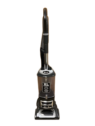 The Shark Professional Navigator Lift-Away UV550 Upright Vacuum by Imagine Sewing & Vacuum features a black and gray design, an XL-capacity dustbin, and a "Shark" labeled handle.