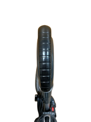 Close-up view of a black bicycle wheel and tire, photographed from above against a white background—with detail akin to an Imagine Sewing & Vacuum Shark Professional Navigator Lift-Away UV550 Upright Vacuum.