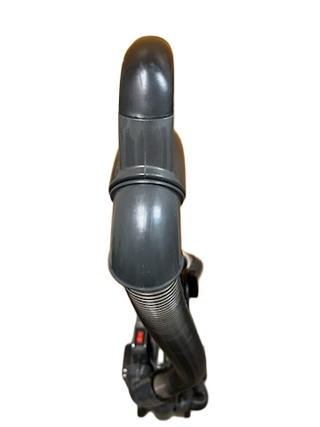 A close-up, top-down view displays the sleek design of the gray Shark Professional Navigator Lift-Away UV550 Upright Vacuum hose and handle from Imagine Sewing & Vacuum, set against a white background.
