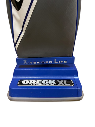 A close-up of the base of an Imagine Sewing & Vacuum Oreck Commercial Vacuum XL2100RHS, showing the "X-Tended Life" and "Oreck XL" labels.