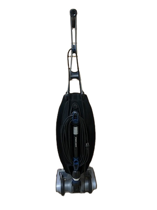 The Oreck Magnesium by Imagine Sewing & Vacuum is a refurbished upright vacuum cleaner with a black bag, gray base, top handle, and front-wrapped power cord; built with quality used parts for reliable performance.