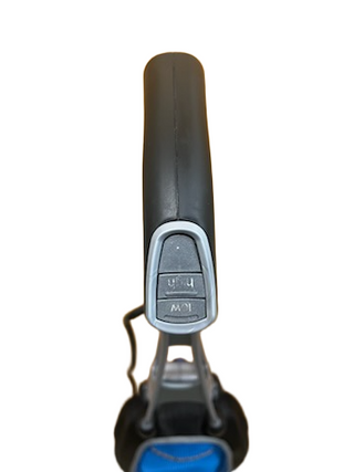 Close-up of the Oreck Magnesium upright vacuum handle by Imagine Sewing & Vacuum, showing "LOW" and "HIGH" labeled buttons for setting adjustments.