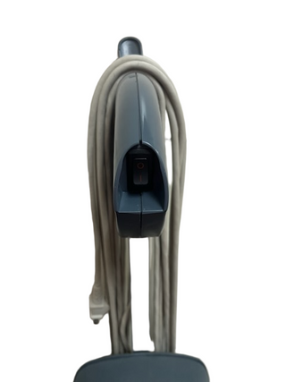 A close-up of the Oreck XL Element handle by Imagine Sewing & Vacuum, featuring a visible power switch and wrapped cord—ideal for efficient thin carpet cleaning as a refurbished vacuum.