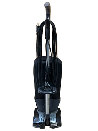 The Oreck XL Platinum by Imagine Sewing & Vacuum features a lightweight black and gray design, shown from the back with its power cord wrapped around hooks against a white background.