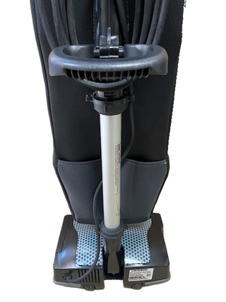 A close-up of the Oreck XL Platinum by Imagine Sewing & Vacuum highlights its handle, power cord, and labeled base. This lightweight vacuum offers easy maneuverability and efficient cleaning.