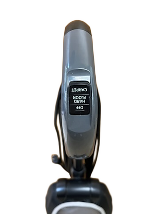 Top view of an Oreck Discover vacuum cleaner handle by Imagine Sewing & Vacuum, featuring a refurbished switch labeled "Carpet," "Hard Floor," and "Off.
