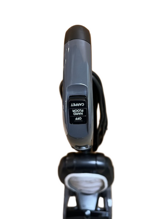 Top view of the Oreck Discover vacuum handle by Imagine Sewing & Vacuum, featuring a switch labeled "CARPET," "OFF," and "HARD FLOOR.