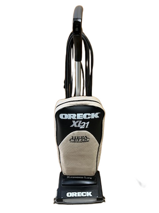 A beige and black Imagine Sewing & Vacuum Oreck XL21 upright vacuum stands on a white background, shown as a refurbished model offering powerful cleaning across most floors.