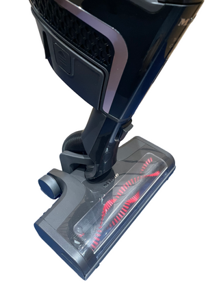 A close-up of the Triflex HX1 Cat and Dog cordless vacuum head by Sew & Vac reveals visible red brushes and a transparent cover, highlighting its sleek design.