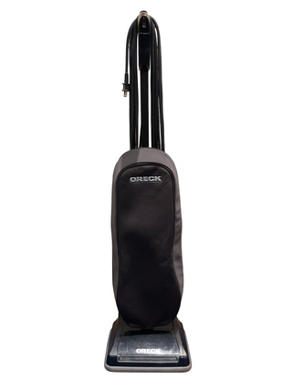 A certified refurbished black Sew & Vac Oreck XL upright vacuum cleaner with a bag and cord is displayed vertically, offering reliable one-speed functionality.