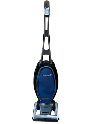 A refurbished Imagine Sewing & Vacuum Oreck Magnesium lightweight vacuum in blue and black is shown standing upright against a white background.