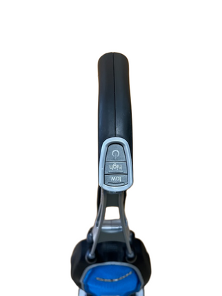 Close-up of a handle with two buttons labeled “Low” and “High” against a white background; part of the Imagine Sewing & Vacuum Oreck Magnesium lightweight vacuum is visible below the handle.