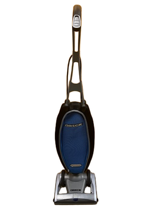 An upright Oreck Magnesium vacuum cleaner from Imagine Sewing & Vacuum, featuring a blue and black dust bag, is displayed standing upright against a white background. This refurbished model delivers reliable performance and exceptional value.