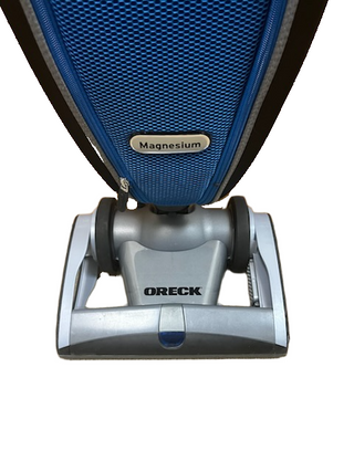 Front view of an Oreck Magnesium vacuum cleaner with a blue cover labeled “Magnesium.” This refurbished vacuum from Imagine Sewing & Vacuum delivers powerful cleaning performance and the reliability you expect from Oreck.