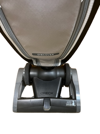 Front view of the Imagine Sewing & Vacuum Oreck Discover lightweight vacuum cleaner photographed against a white background.
