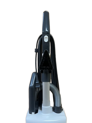 Back view of a refurbished Sebo X4 upright vacuum with a coiled power cord and a flexible hose.