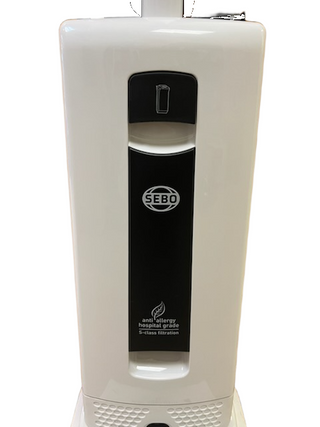 Refurbished Sebo X4 upright vacuum cleaner with a white body, black control panel, and a label indicating hospital-grade anti-allergy S-class filtration.