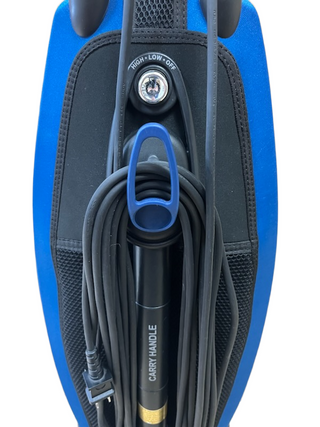 Back view of a refurbished Oreck Magnesium LW100 vacuum showing the power cord wrapped around a blue hook and a power switch with high, low, and off settings.