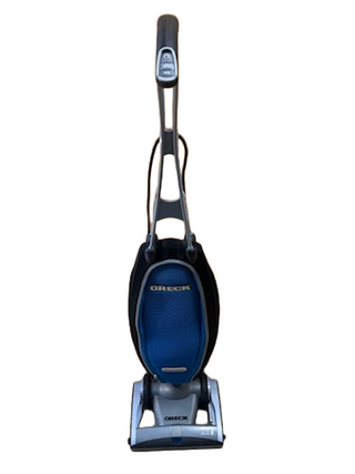 Refurbished Oreck Magnesium upright vacuum cleaner with a blue fabric bag and gray handle.