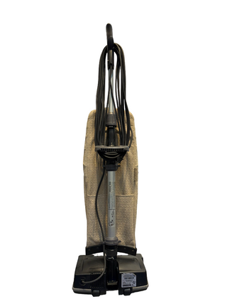 Refurbished Oreck XL21 upright vacuum cleaner by Imagine Sewing & Vacuum, featuring a beige cloth bag, black base, and coiled power cord, shown against a white background.