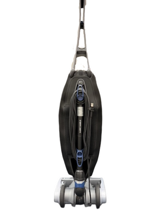 An Oreck Magnesium upright vacuum cleaner by Imagine Sewing & Vacuum is shown front-facing with its cord wrapped around the handle, photographed on a white background—perfect as a refurbished vacuum for carpets.