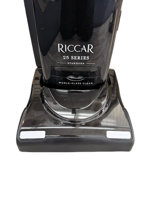 The Imagine Sewing & Vacuum Riccar R25 Standard upright vacuum features a black base labeled "World-Class Clean" and a self-adjusting brushroll for effortless cleaning.