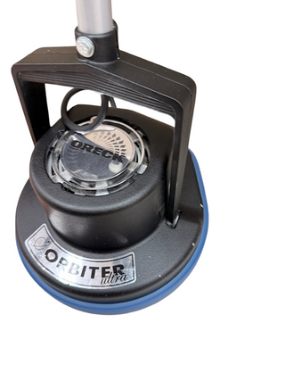 Close-up of a refurbished Oreck Orbiter floor cleaner by Imagine Sewing & Vacuum, showing the handle and part of the blue cleaning pad.