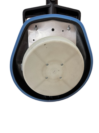 Close-up of the Oreck Orbiter's circular scrubbing pad, with blue and black casing, from Imagine Sewing & Vacuum.