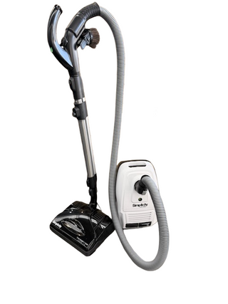 The Simplicity Wonder by Imagine Sewing & Vacuum is a canister vacuum with HEPA filtration, a white body, long flexible hose, and black floor attachment shown on a white background.