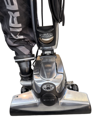 A refurbished Kirby Altair Platinum vacuum from Imagine Sewing & Vacuum is displayed upright on a white background, highlighting its strong suction and premium cleaning features.