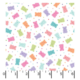 Kimberbell Maywood Studios Sweet Shoppe Gummy Bears White MAS11029-W fabric features colorful gummy bears and polka dots on white—ideal for quilting cotton projects or matching Kimberbell Sweet Shoppe designs. Ruler scale shown for sizing. Brand: Maywood Studios.