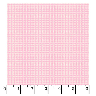 A square of light pink, diamond-patterned Kimberbell Maywood Studios Sweet Shoppe Diamonds Pink MAS11031-P quilting fabric is shown with a black ruler along the bottom and left edges, marked in inches from 0 to 6.