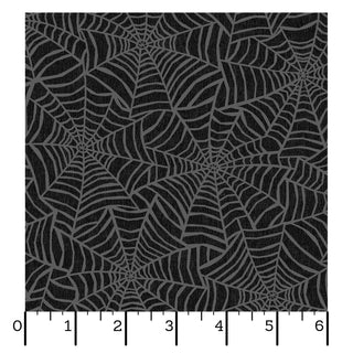 The Maywood Studios Pumpkin Grove SPIDER WEBS BLACK MAS11183-J fabric from 47-EE Schenck features a charming repeating gray spiderweb pattern set against a black background, as shown with a 6-inch ruler for scale. Sold by the yard and eligible for free shipping, this fabric is ideal for your next creative project.
