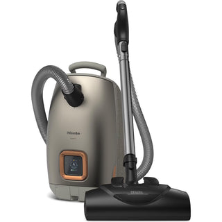 The Miele L1 Guard canister vacuum cleaner by Imagine Sewing & Vacuum, featuring a hose, carry handle, and large floor brush attachment, is shown against a white background.