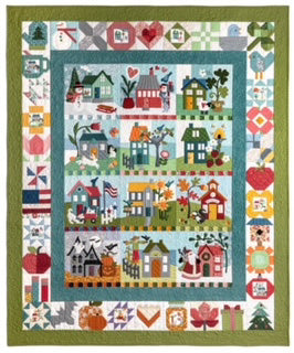 The Sew & Vac On Wander Lane II BOM- sew-Layton (Luanne Probasco) series features a quilt with a charming house design.