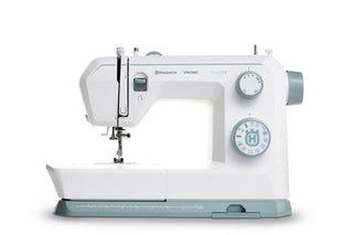 The Husqvarna Viking Onyx 15 sewing machine by 38-SVP - Singer Viking Pfaff, in white and gray, ideal for beginners, is displayed against a plain white background.