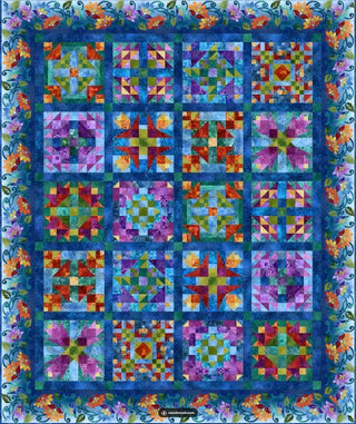 A vibrant quilt with colorful flowers and squares, made from Prism BOM- Ogden fabric by Sew & Vac brand.