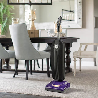 A purple Riccar R10S Lightweight Supralite Standard vacuum cleaner in a living room.