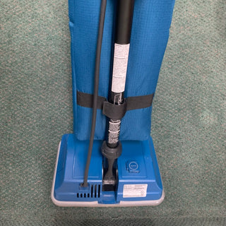 A brand new Sew & Vac Royal Upright vacuum cleaner sitting on a carpet.