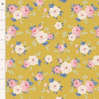 The Tilda Sunday Brunch PERNILLE YELLOW TIL100588 from Fabric by Tilda is a mustard yellow premium quilting cotton with pink and white roses, green leaves, a vintage summerhouse vibe, and an inch ruler on the left edge.