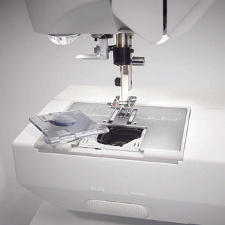 An image of a Husqvarna Viking Opal 670 sewing machine on a white background.