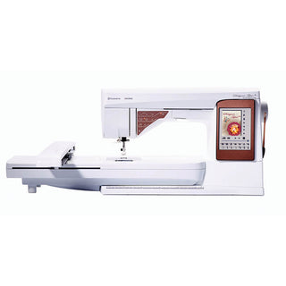 A white and brown Husqvarna Viking sewing machine on a white background, specifically the Husqvarna Designer Topaz 50.