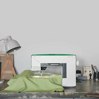 A Husqvarna Designer Jade 35 sewing machine on a table. (Brand Name: Husqvarna Viking)