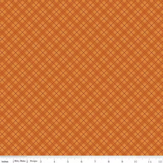 Bountiful by Sandy Gervais for Riley Blake Designs (56-Riley Blake) C17863-AUTUMN PLAID AUTUMN fabric yardage features an orange grid pattern with thin black diagonal lines over a textured background. Crafted in premium cotton, this fabric is sold by the yard and includes a white ruler with inch measurements at the bottom.