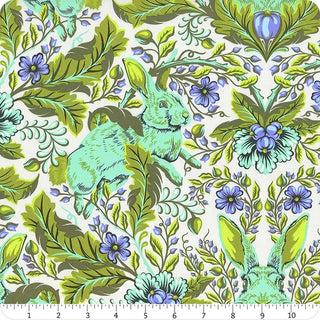 Crafted by Free Spirit and TULA PINK, the Tula Pink Full Moon Forest II PWTP.246-STARLIGHT (Hoppy Go Lucky) quilting cotton features a vibrant design of green leaves, blue flowers, and whimsical light blue rabbits. With an included inch ruler for precise measurement, this fabric yardage is ideal for sewing and craft projects inspired by Tula Pink’s playful style.
