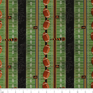1683544B 16835-44 Grid Iron Stripe Green/Multi Skyline Studio TOUCHDOWN fabric sold by the yard, featuring a repeating pattern of football fields, brown footballs, and play diagrams in vertical stripes.