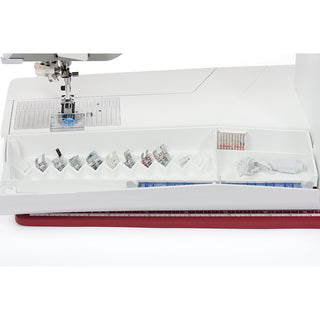 The Husqvarna Viking Designer Ruby 90 by 38-SVP features an open accessory compartment with presser feet, bobbins, and sewing tools—perfect for enhancing your embroidery experience.
