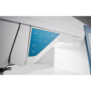 Close-up of the Husqvarna Viking Designer Sapphire 85 sewing and embroidery machine control panel, showcasing buttons for speed, stop, fix, start, and stop in a modern white and blue design.