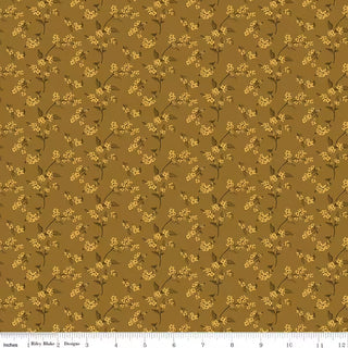 Bountiful by Sandy Gervais for RBD C17865-SUEDE BITTERSWEET SUEDE Fabric Yardage from 56-Riley Blake features brown quilting cotton with a repeating pattern of small yellow floral sprigs, shown with a white measuring ruler along the bottom edge for scale. This premium fabric is sold by the yard and is perfect for all your quilting and crafting projects.